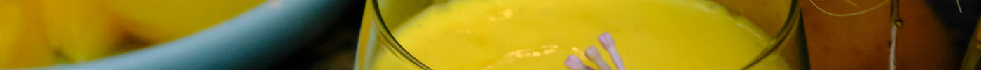 Tropical golden smoothie in a clear glass